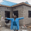 BREAKING: A video of a lady trending online showcases her returning home to build a house after diligently saving her salary for two years